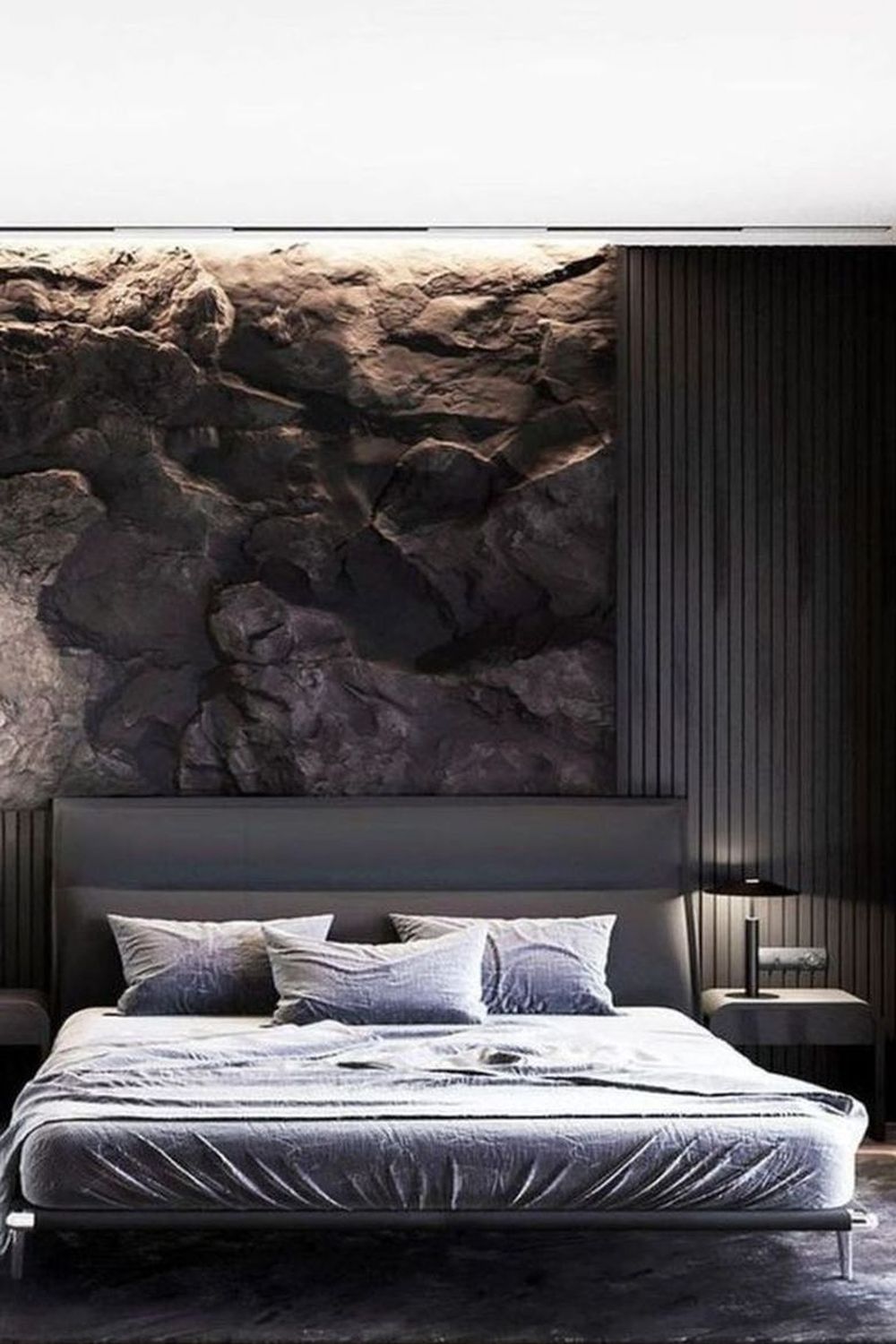 cтеновые панели декорирование стены за кроватью черными фотообоями под камень и 3D панелями